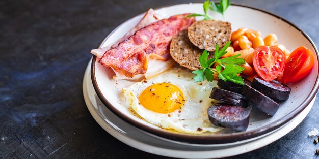 English breakfast fried egg black pudding blood sausage cereal bread beans bacon scrambled eggs