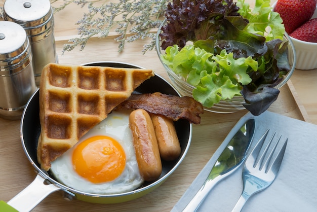 English breakfast fried egg sausage waffle
