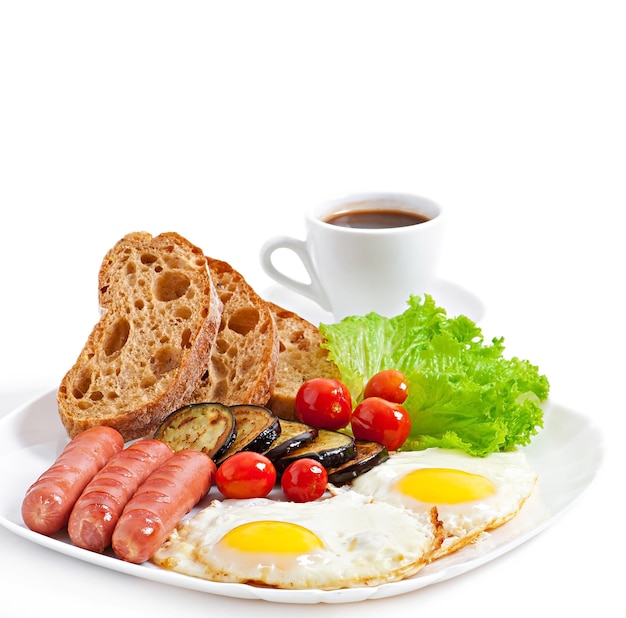 english breakfast fried eggs sausages eggplant and tomatoes