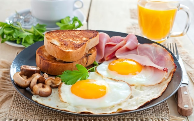 English breakfast Fried eggs with mushrooms and ham with a glass of orange juice for breakfast