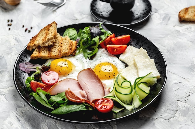 English breakfast Fried eggs with toast and ham and coffee. banner, menu recipe, top view.