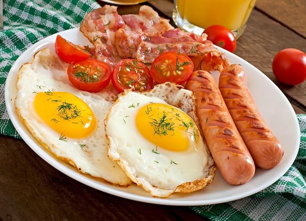 English breakfast toast egg bacon and vegetables in a rustic style on wooden background