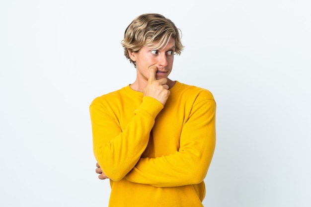 English man over isolated white background nervous and scared