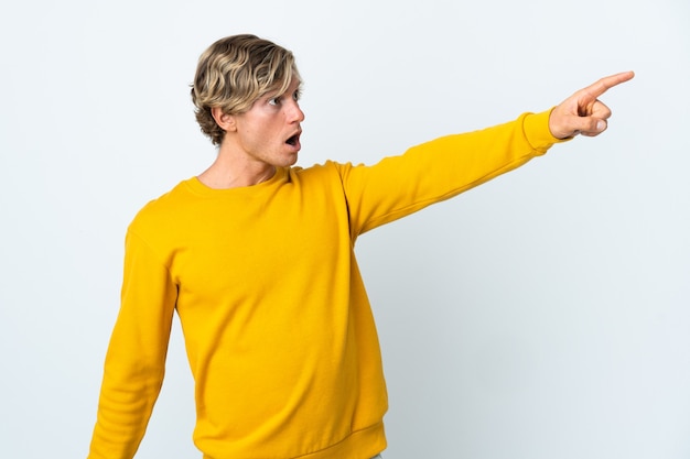 Photo english man over isolated white background pointing away