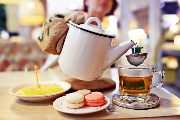 English tea in a cafe / cup and kettle with five o'clock tea