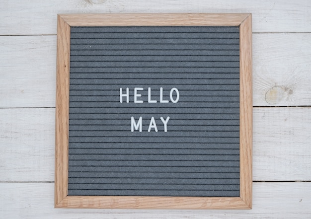 English text Hello May on a letter Board in white letters