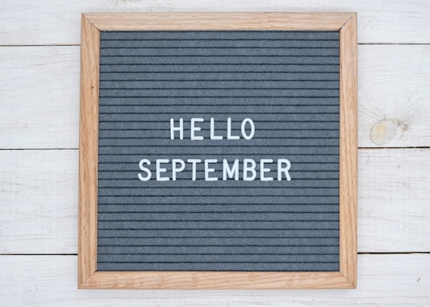 English text Hello September on a letter Board in white letters