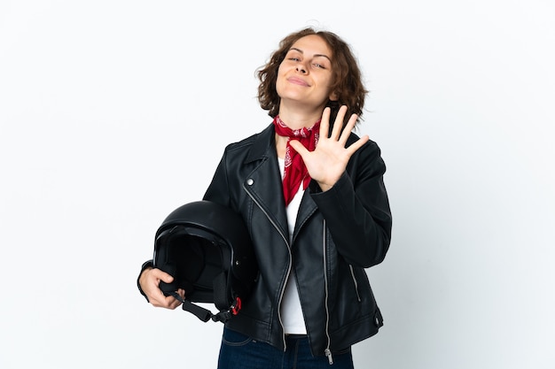 English woman holding a motorcycle helmet isolated counting five with fingers
