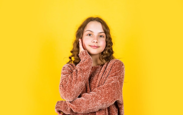 Enjoy silky hair Beautiful little model Healthy curls Easy hairdo Hairdresser salon Pretty girl curly hair yellow background Adorable small child Beauty supplies Perfectly untangle curly hair