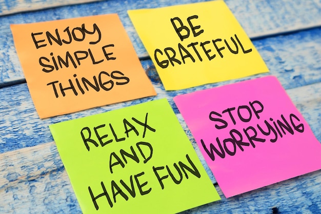 Photo enjoy simple things be grateful relax have fun stop worrying text words typography written on paper