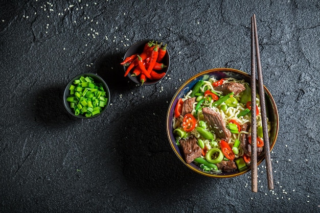 Enjoy your asian noodle with beef and vegetables