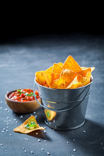 Enjoy your nachos with red pepper dip and salt