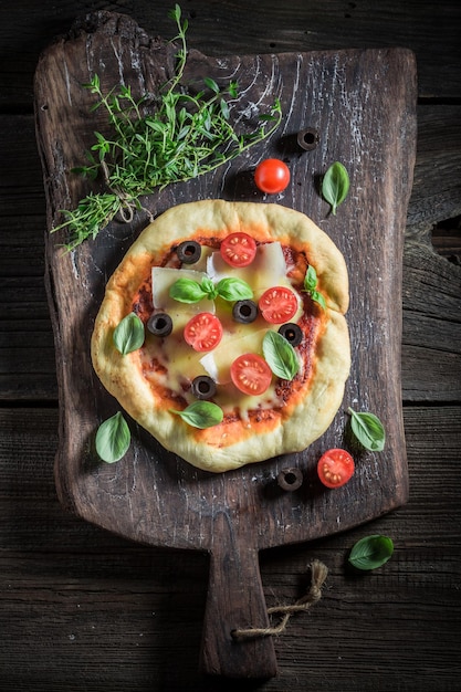 Enjoy your pizza made of cheese tomatoes and herbs