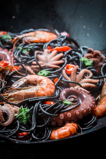 Enjoy your spaghetti with seafood with shrimp octopus and parsley