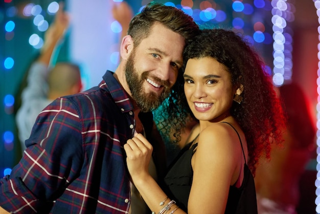 Enjoying a couples night out at the club Portrait of an affectionate young couple enjoying the evening in a nightclub