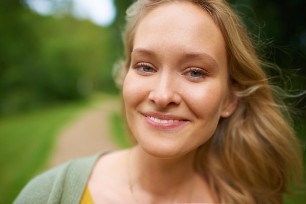 Enjoying a day in the park Portrait of an attractive young woman in nature