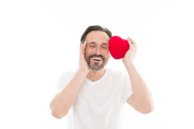 Enjoying happy moments. Man with beard. Decorative for valentines day. Love. problems with heart. Mature bearded man with red heart. heart transplant. Holiday celebration. Valentines day. Health care.