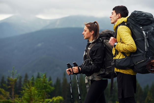 Enjoying hiking together Majestic Carpathian Mountains Beautiful landscape of untouched nature