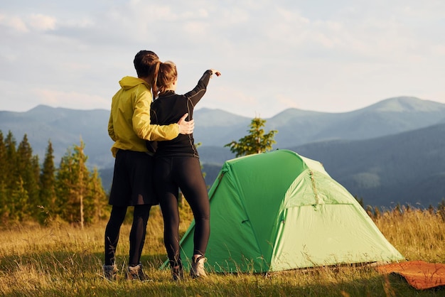 Enjoying hiking together Majestic Carpathian Mountains Beautiful landscape of untouched nature