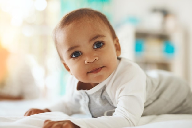 Enjoying some tummy time Shot of an adorable little baby at home