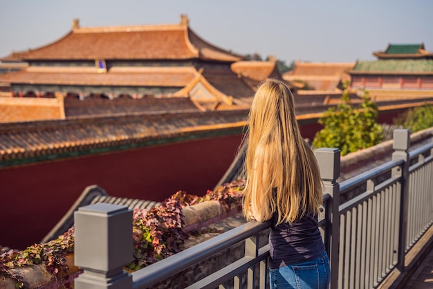 Enjoying vacation in China Young woman in Forbidden City Travel to China concept Visa free transit 72 hours 144 hours in China