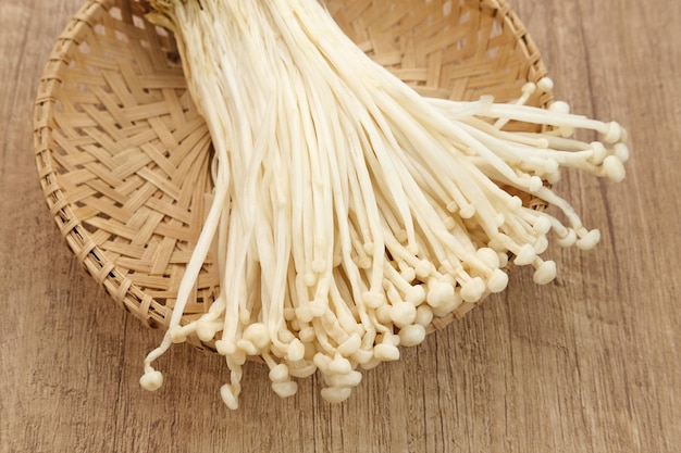 Enoki mushrooms (jamur enoki), an edible mushroom with a long white fruiting body like bean sprouts