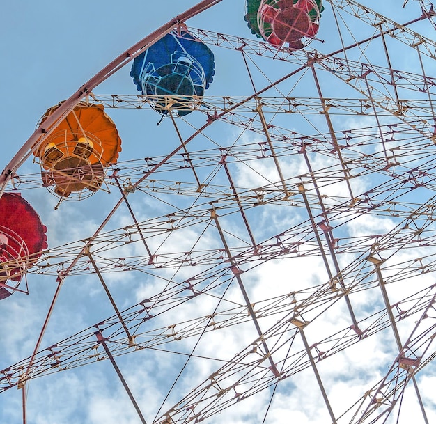 Entertainment ferris wheel against the blue sky