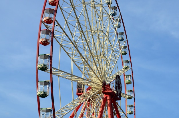 Entertainment Ferris wheel against the clear blue sky