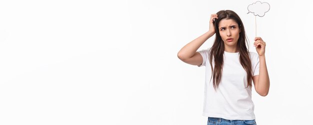 Entertainment fun and holidays concept portrait of puzzled indecisive young brunette girl female stu