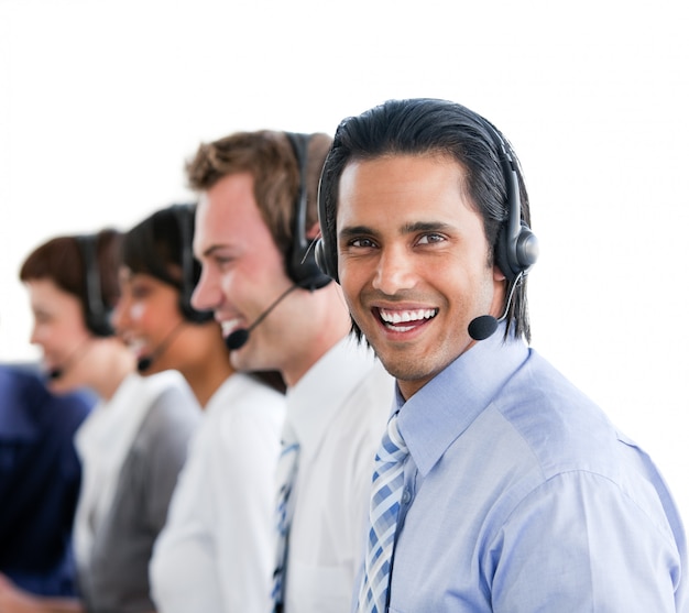 Enthusiastic business people working in a call center 