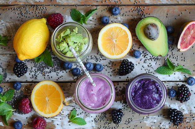 an enticing scene of vibrant fresh fruit smoothies in mason jars adorned with reusable straws