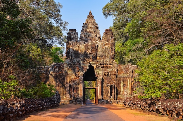 Entrance to ancient Angkor Wat temple at sunrise