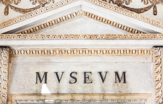 Entrance of an ancient museum, letters on original marble