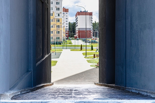 Entrance to the courtyard of an apartment building. Modern urban housing construction.