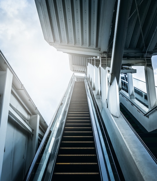 Entrance of escalator at subway station with sunlight. Future concepts.