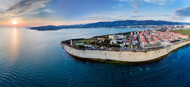 Entrance from a height to the Gelendzhik Bay at sunset in calm windless weather