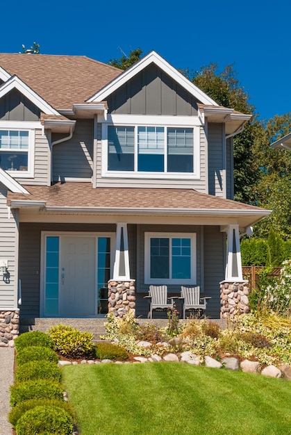 Entrance of luxury house with mown grass lawn in front