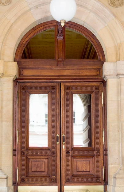 Entrance wooden door with panels