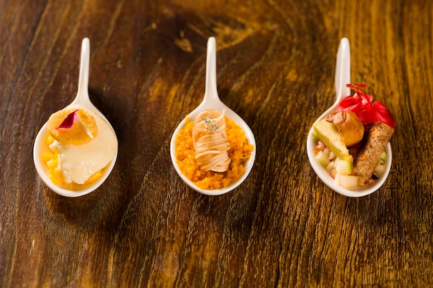 Entree and dessert of finger food in a spoon