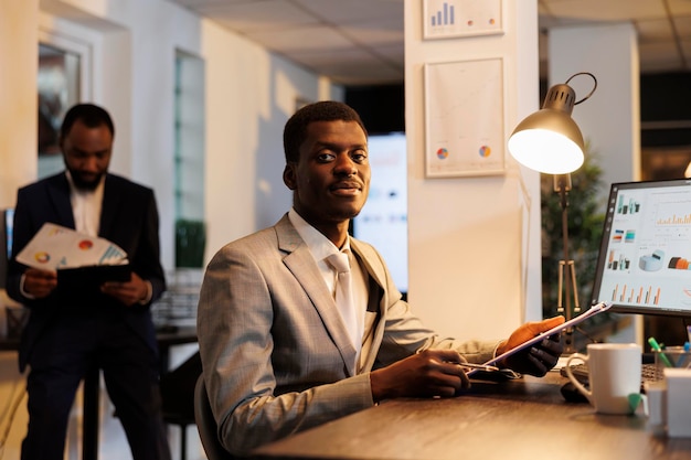 entrepreneur in formal suit working at company strategy analyzing papers with financial statistics in startup office executive manager brainstorming business ideas trying to increase profit