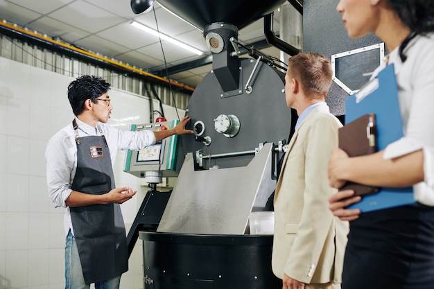 Entrepreneur showing equipment to inspectors