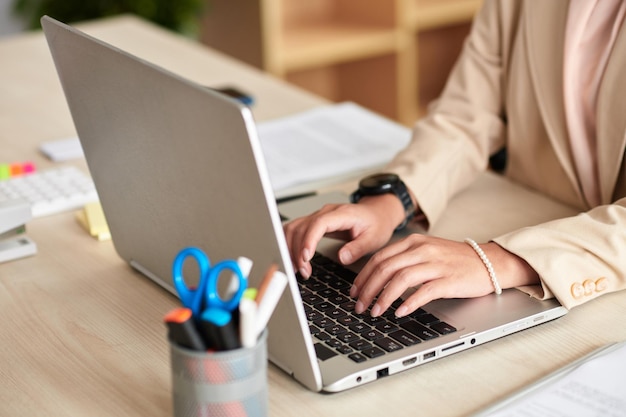 Entrepreneur Typing on Laptop