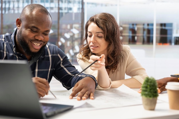 Entrepreneurs collaborating with a contractor agent on office space planning