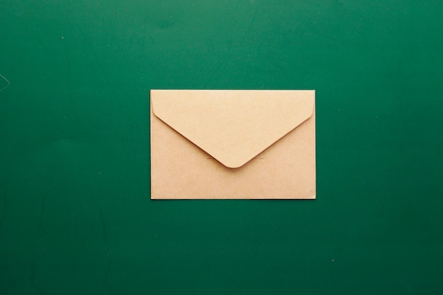 A envelope drops on a green color background