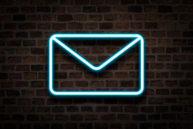 envelope, the neon sign on the background of the fire wall. Email concept, business.