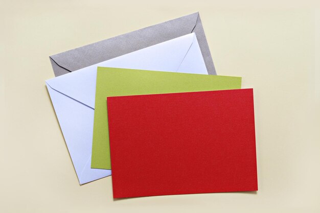 Photo envelope with blank paper against beige background