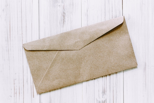 A envelope on wooden background