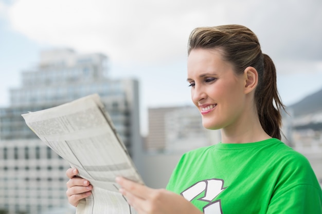 Environmental activist reading newspaper