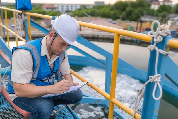 Environmental engineers work at wastewater treatment plantsWater supply engineering working at Water recycling plant for reuse