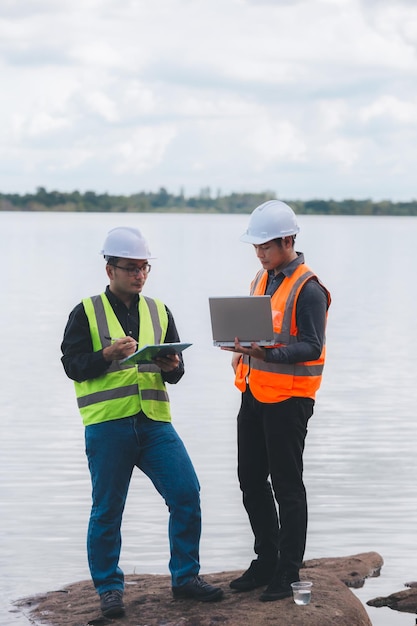 Environmental engineers work at wastewater treatment plantsWater supply engineering working at Water recycling plant for reuseTechnicians and engineers discuss work together